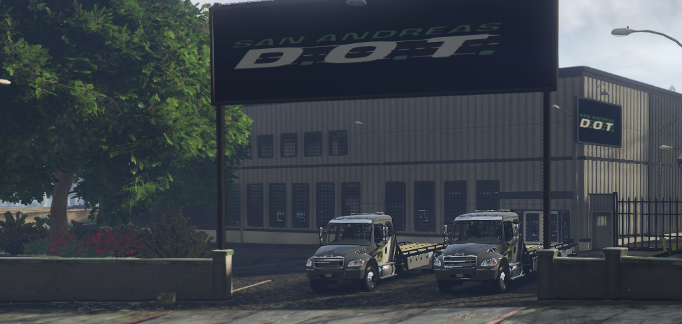 San Andreas Department of Transportation trucks outside the DOT facility